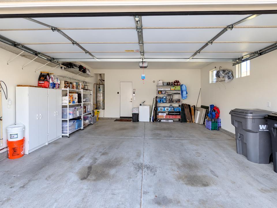Garage after organizing, with belongings grouped along the walls and open floor space